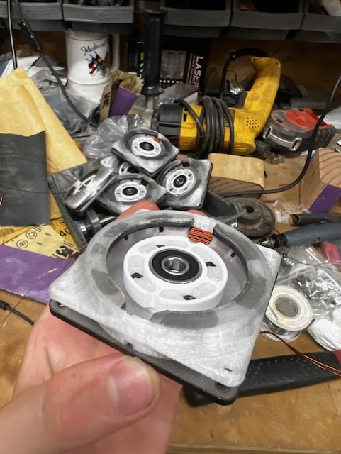 Pile of scrap and test prints on a workbench